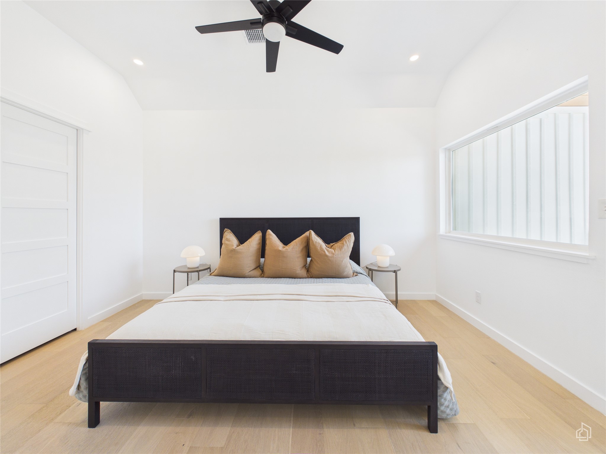 5912 Harold Court, Unit 105 Austin, TX 78721 - Photo 22 of 32 a bedroom with a bed and window