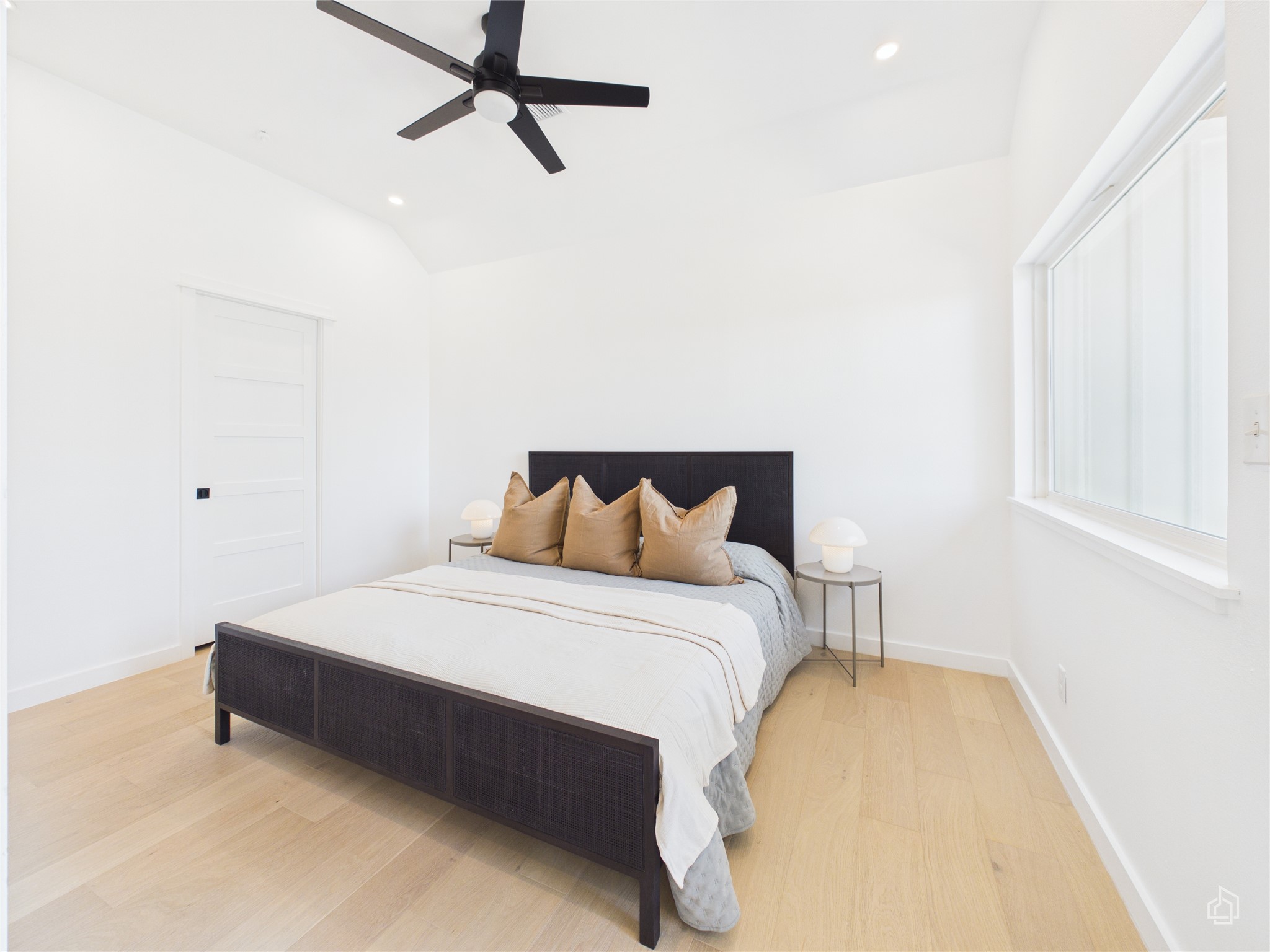 5912 Harold Court, Unit 105 Austin, TX 78721 - Photo 23 of 32 a spacious bedroom with a bed and a window