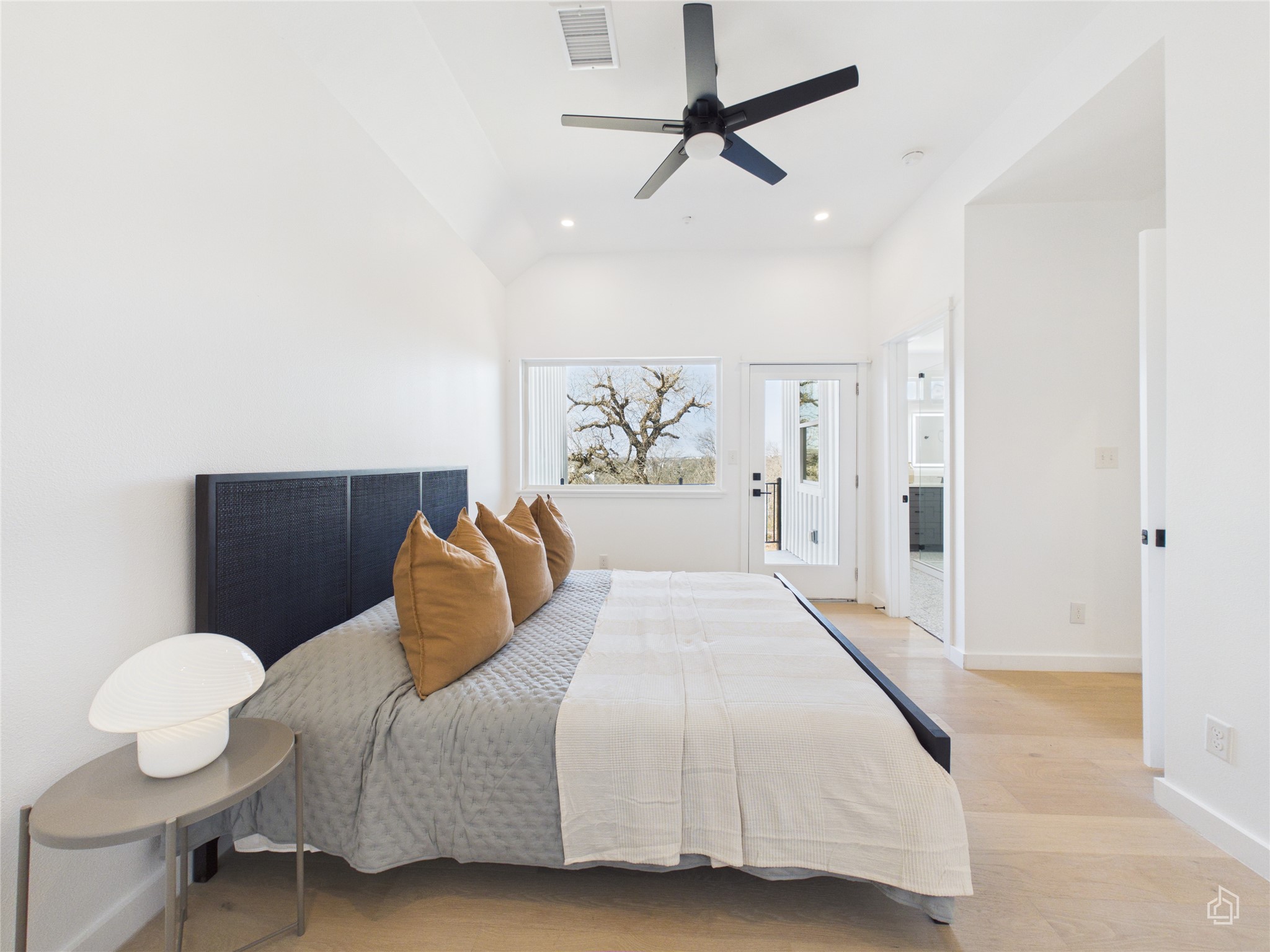 5912 Harold Court, Unit 105 Austin, TX 78721 - Photo 24 of 32 a bedroom with a bed and window