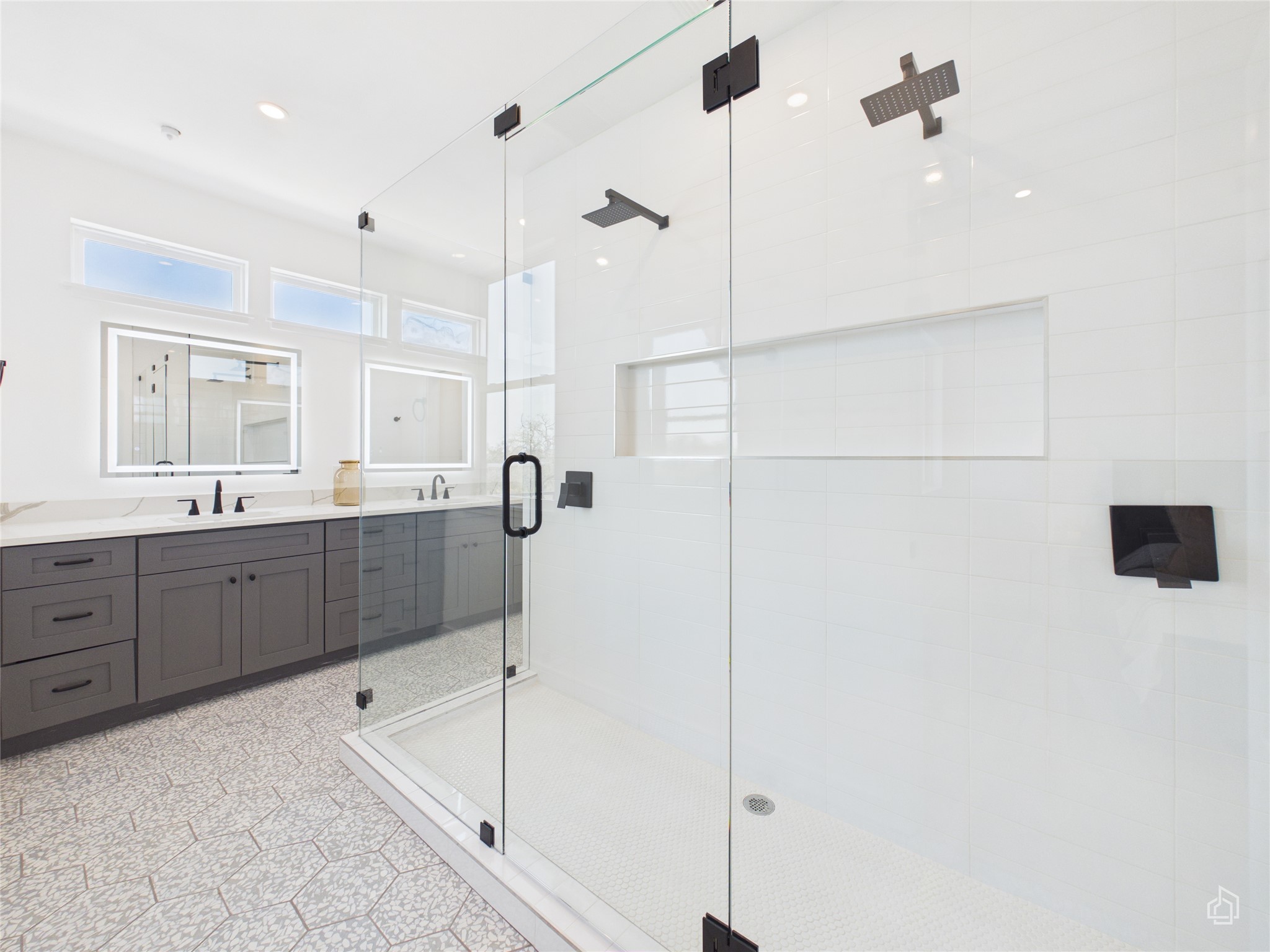 5912 Harold Court, Unit 105 Austin, TX 78721 - Photo 25 of 32 a large bathroom with a tub a sink a mirror and vanity
