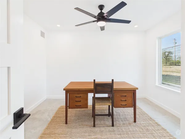 a workspace with furniture and a window