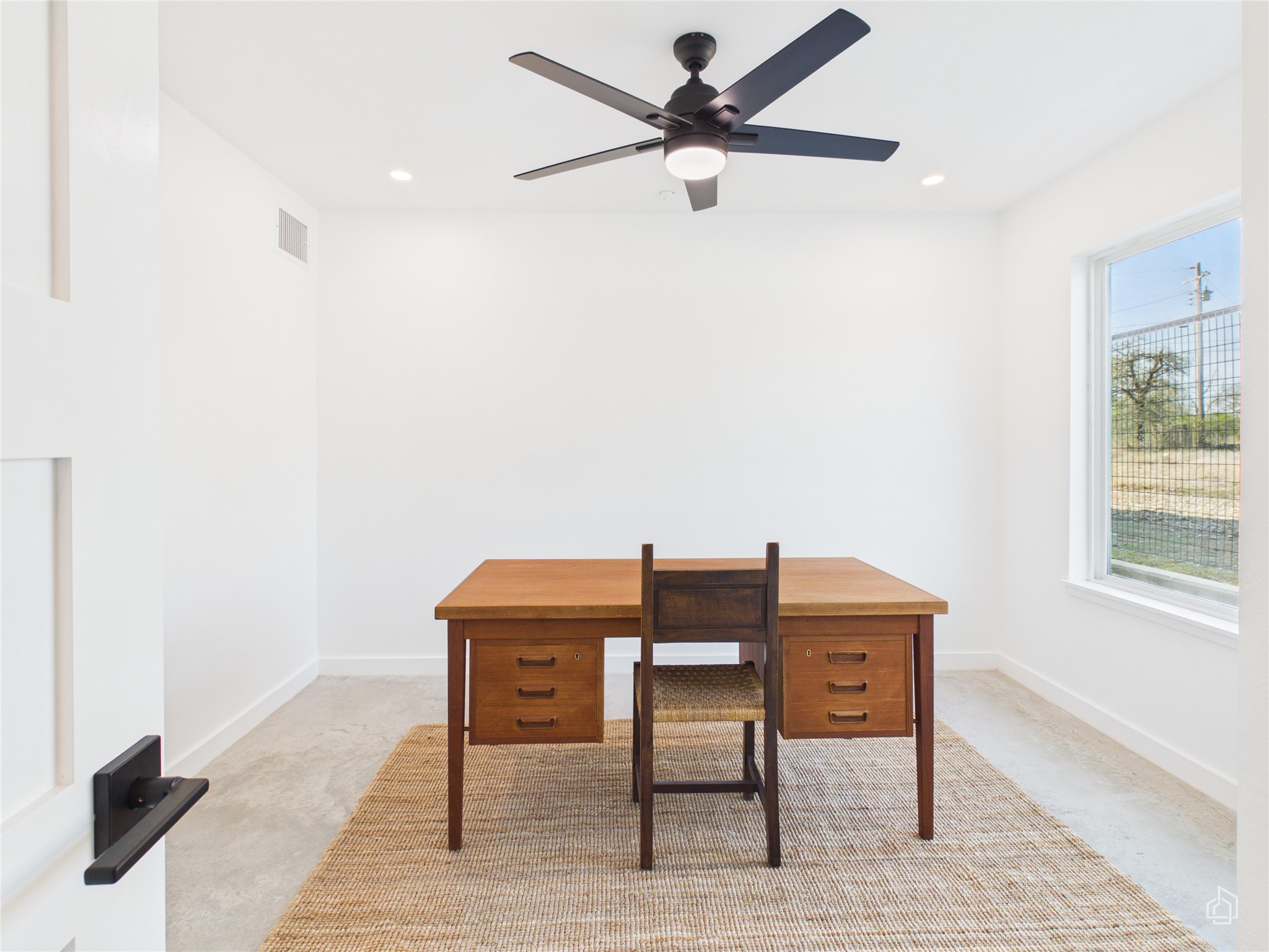 5912 Harold Court, Unit 105 Austin, TX 78721 - Photo 6 of 32 a workspace with furniture and a window