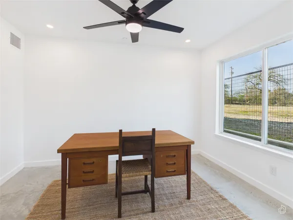 a workspace with furniture and window