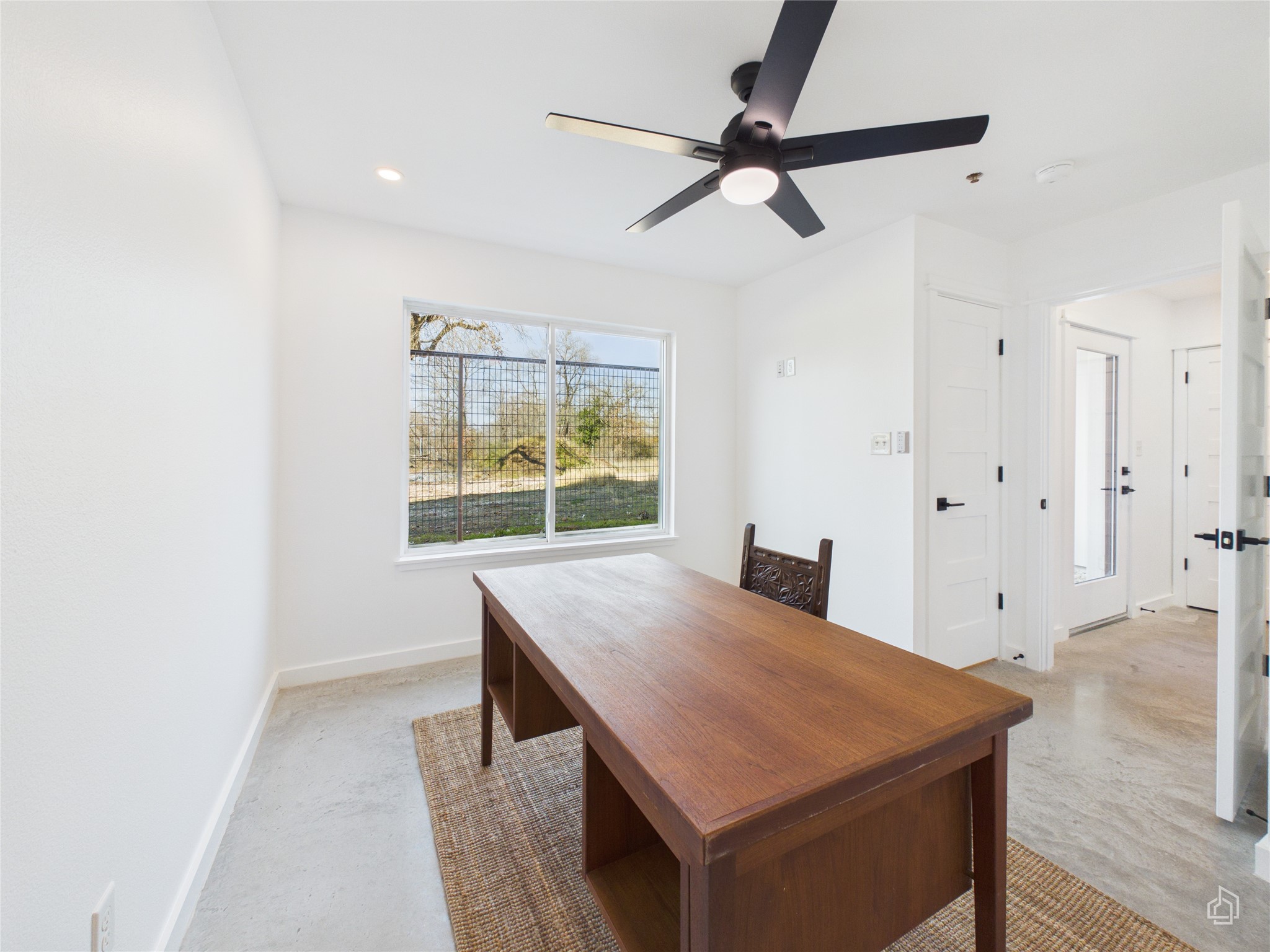 5912 Harold Court, Unit 105 Austin, TX 78721 - Photo 9 of 32 a view of an empty room and window