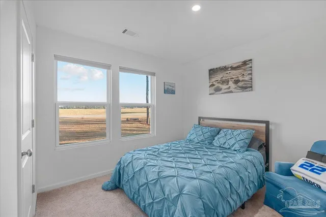 a room with furniture and flat screen tv