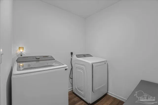 a reading room with furniture and a potted plant