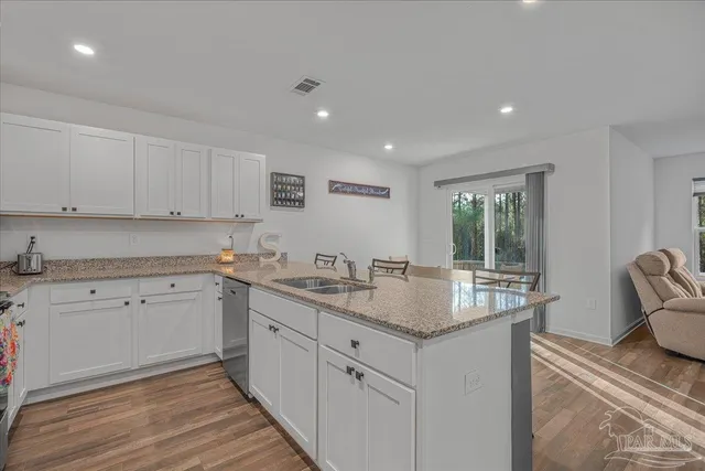 a view of a dining room with furniture and a window