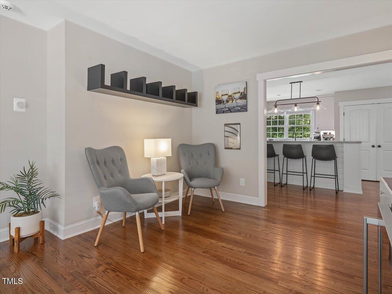 1310 Carolina Pines Avenue Raleigh, NC 27603 - Photo 15 of 53 a living room with furniture and a wooden floor