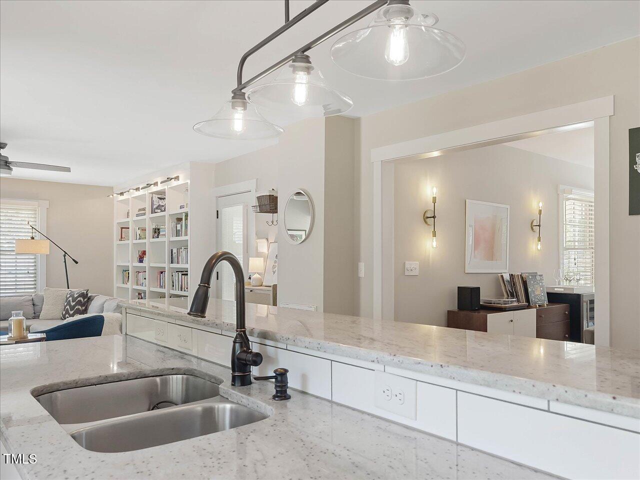 1310 Carolina Pines Avenue Raleigh, NC 27603 - Photo 19 of 53 a kitchen with a sink and a potted plant