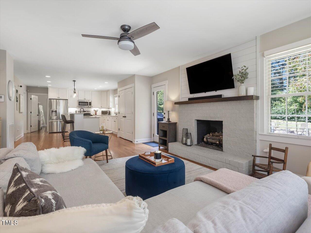 1310 Carolina Pines Avenue Raleigh, NC 27603 - Photo 25 of 53 a living room with furniture fireplace and flat screen tv