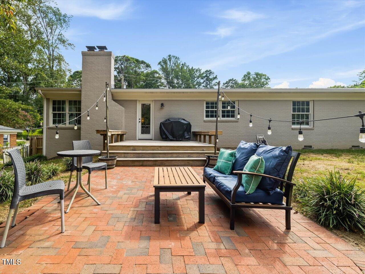 1310 Carolina Pines Avenue Raleigh, NC 27603 - Photo 29 of 53 a house view with a sitting space fire pit and outdoor space