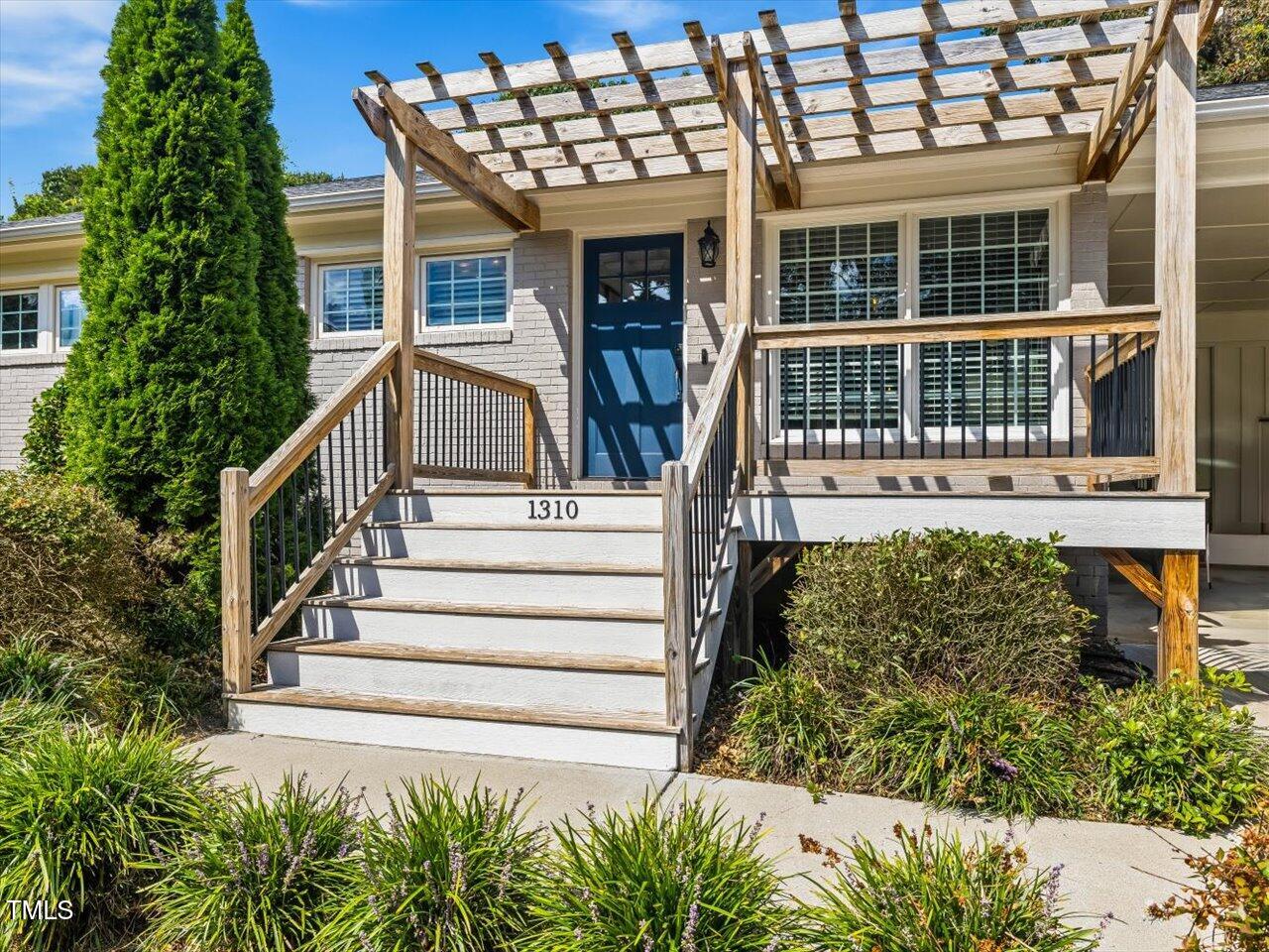 1310 Carolina Pines Avenue Raleigh, NC 27603 - Photo 2 of 53 front view of a house with a yard
