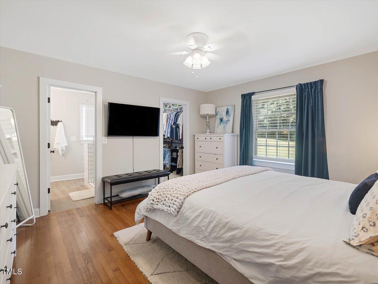 1310 Carolina Pines Avenue Raleigh, NC 27603 - Photo 31 of 53 a bedroom with a bed and a flat screen tv