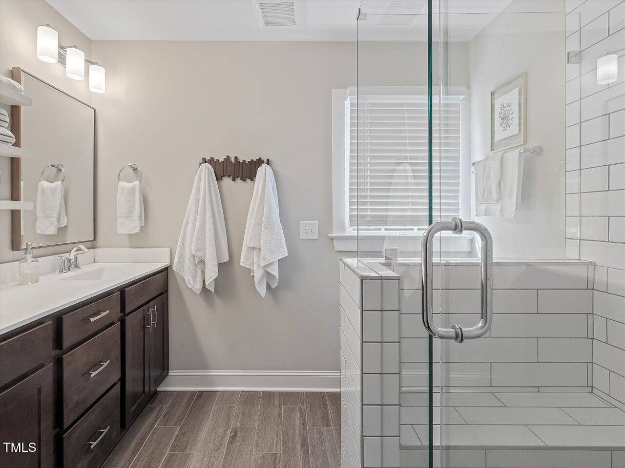 1310 Carolina Pines Avenue Raleigh, NC 27603 - Photo 33 of 53 a bathroom with a sink and mirror