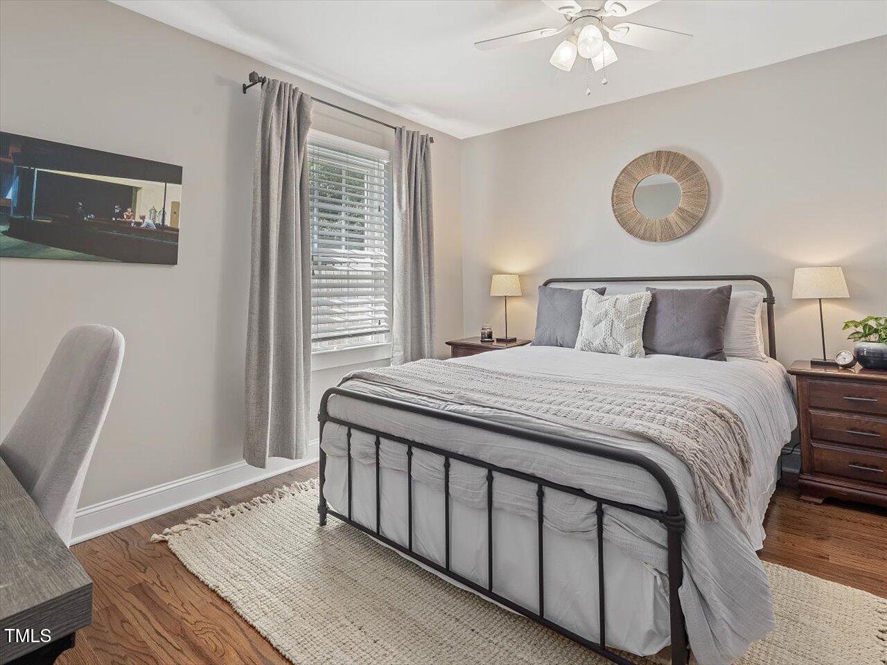 1310 Carolina Pines Avenue Raleigh, NC 27603 - Photo 37 of 53 a bedroom with a bed lamp and a window