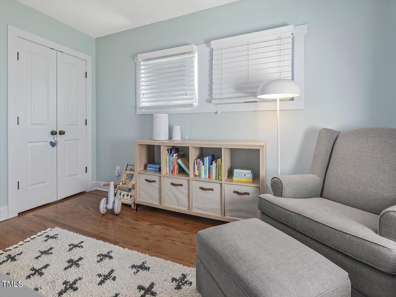 1310 Carolina Pines Avenue Raleigh, NC 27603 - Photo 39 of 53 a living room with furniture and a wooden floor
