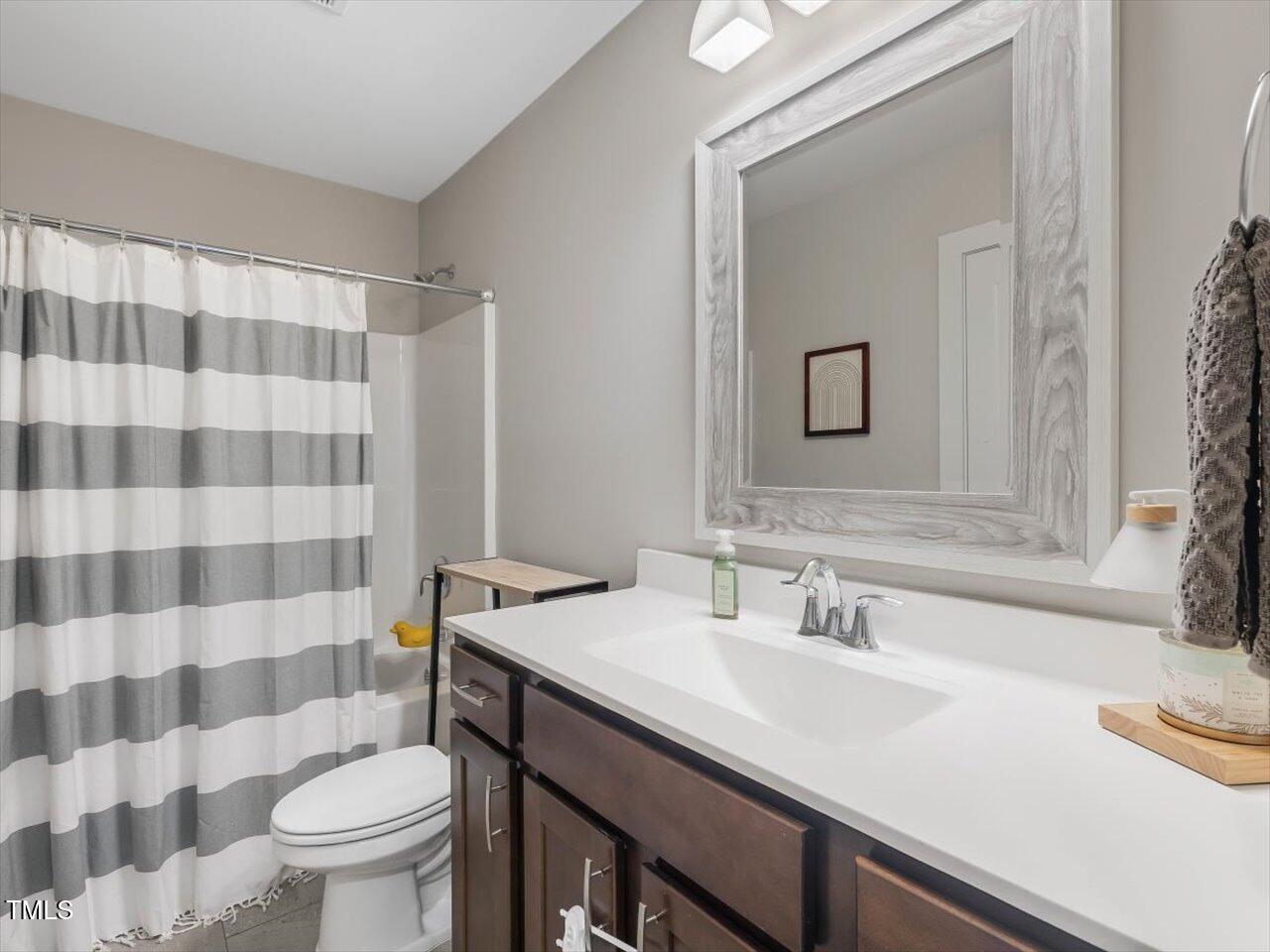 1310 Carolina Pines Avenue Raleigh, NC 27603 - Photo 40 of 53 a bathroom with a sink toilet and shower