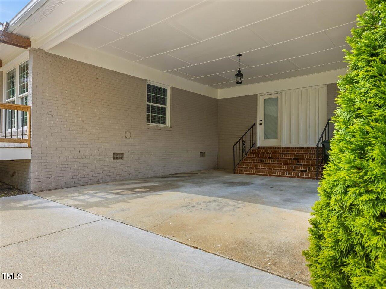 1310 Carolina Pines Avenue Raleigh, NC 27603 - Photo 44 of 53 a view of a room with stairs and a potted plant