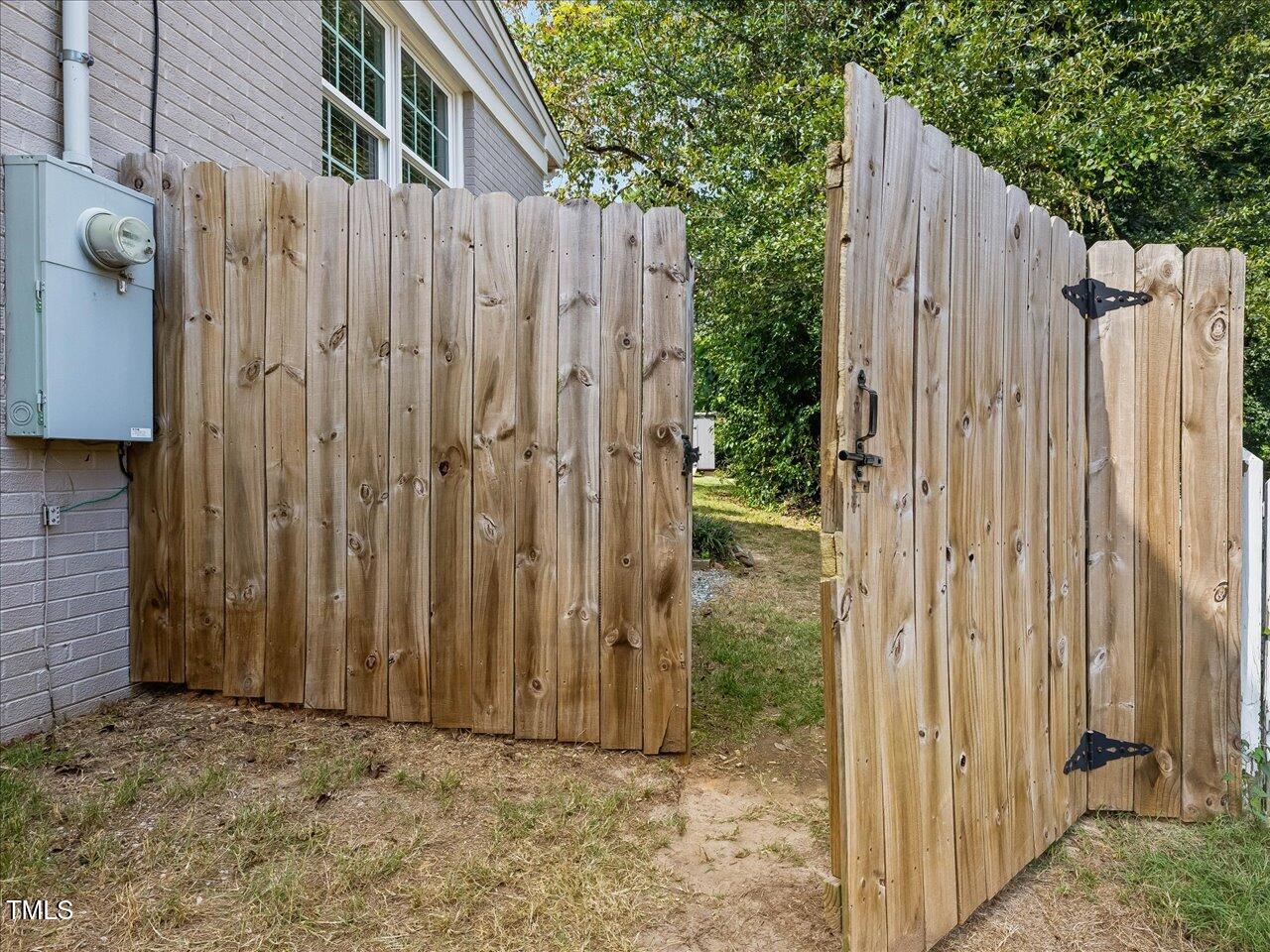 1310 Carolina Pines Avenue Raleigh, NC 27603 - Photo 45 of 53 a view of a wooden fence with a cabin