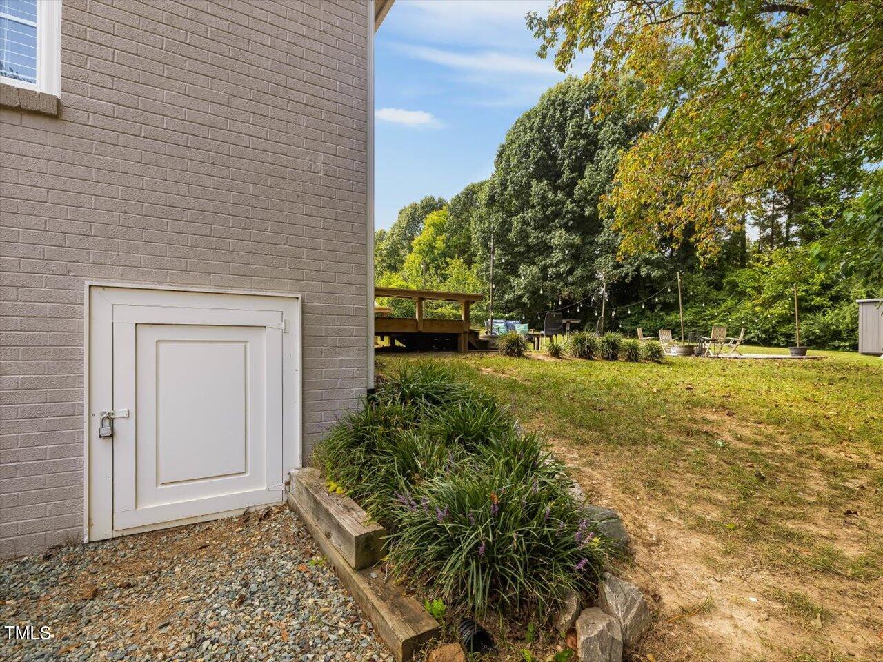 1310 Carolina Pines Avenue Raleigh, NC 27603 - Photo 46 of 53 a view of a yard with plants and trees