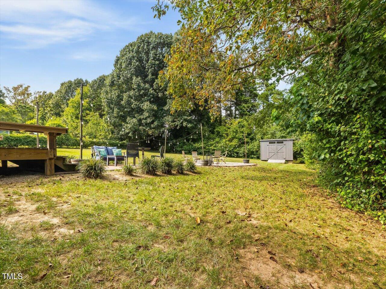 1310 Carolina Pines Avenue Raleigh, NC 27603 - Photo 47 of 53 a backyard of a house with lots of green space