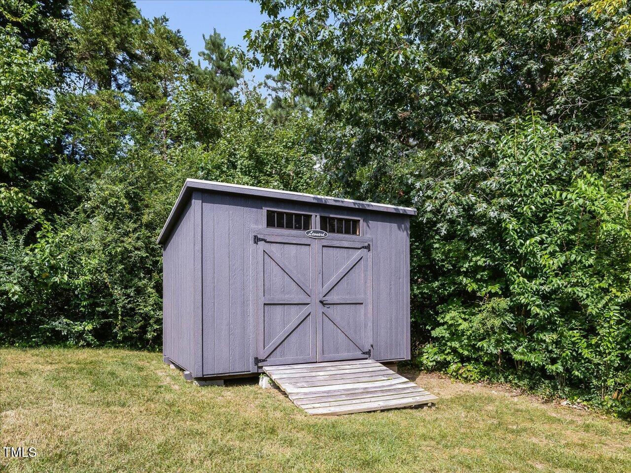 1310 Carolina Pines Avenue Raleigh, NC 27603 - Photo 50 of 53 a view of backyard with small cabin