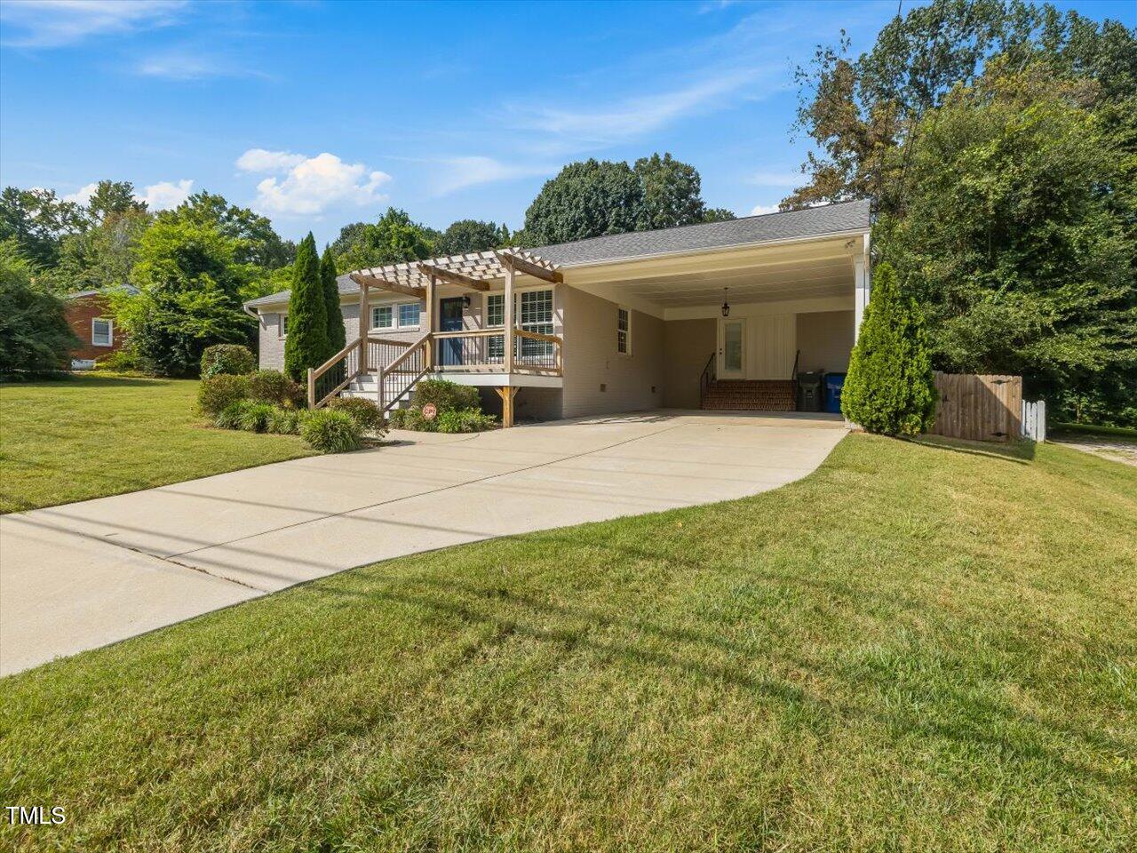 1310 Carolina Pines Avenue Raleigh, NC 27603 - Photo 9 of 53 a front view of a house with yard and green space
