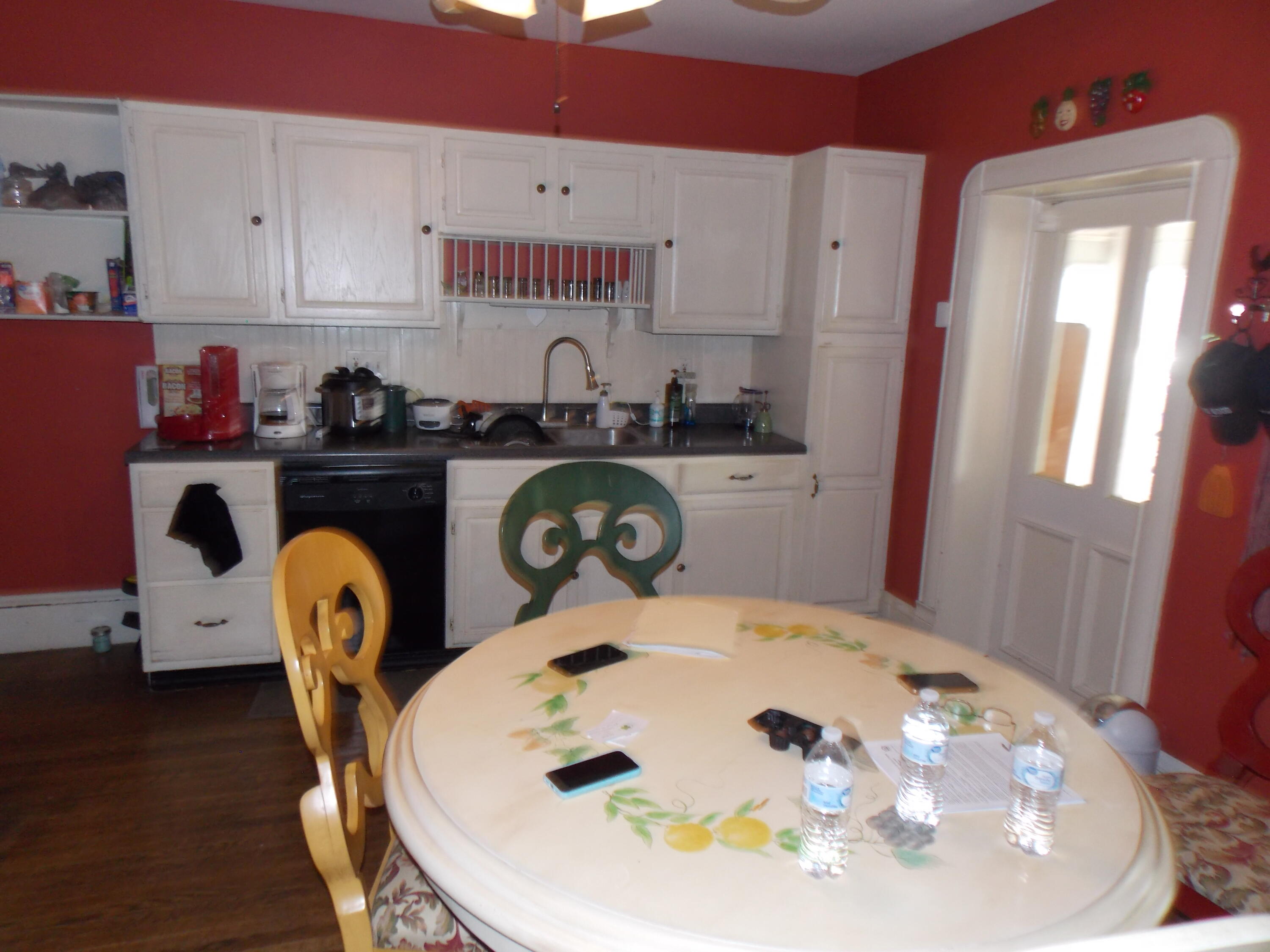 624 South Maple Street Vinton, VA 24179 - Photo 23 of 43 a kitchen with stainless steel appliances a dining table a stove a microwave and a refrigerator