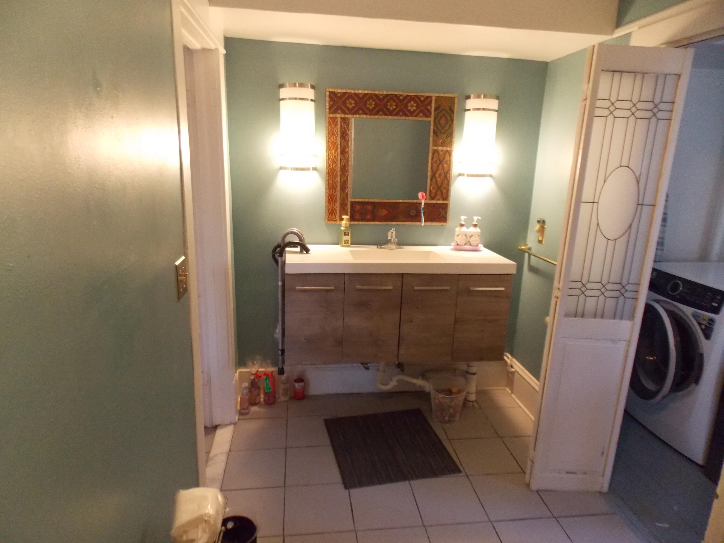 624 South Maple Street Vinton, VA 24179 - Photo 39 of 43 a bathroom with a sink and a mirror