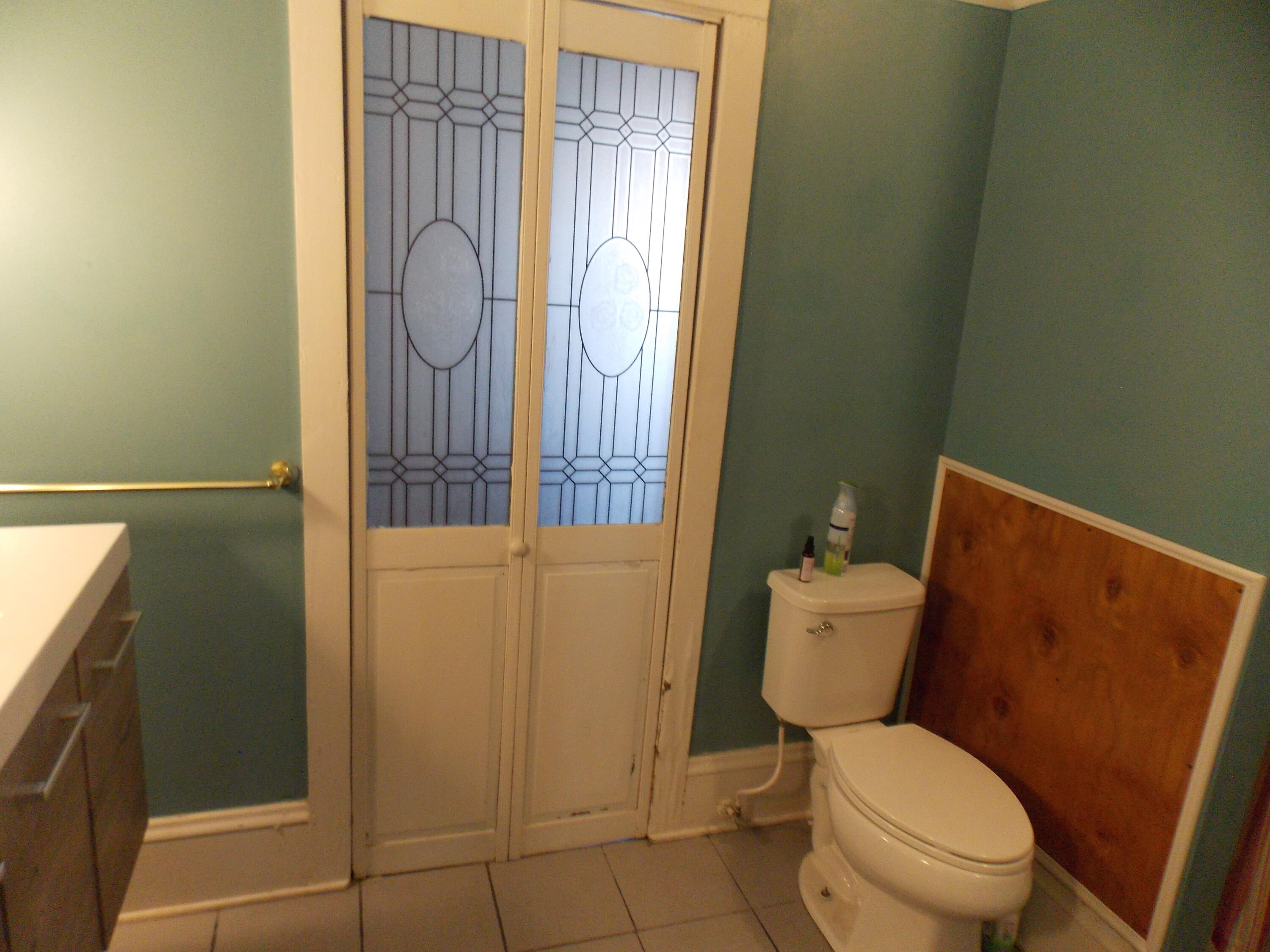 624 South Maple Street Vinton, VA 24179 - Photo 42 of 43 a white toilet sitting next to a shower curtain