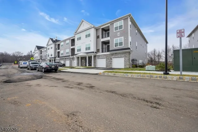 a view of a street in front of a building