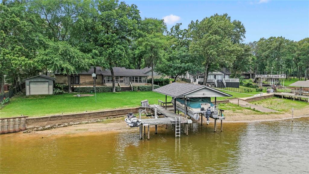 111 Deer Island Road Mabank, TX 75156 - Photo 23 of 26 Aerial of backyard home offers wonderful backyard, and extra workshop storage with built-ins.
