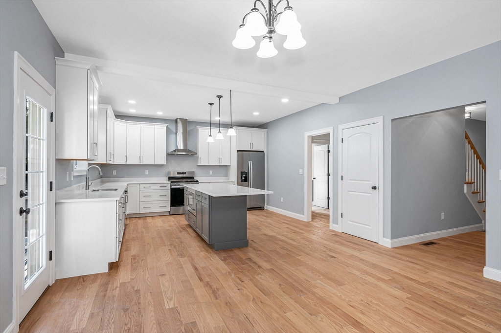 17 Norris Road Tyngsborough, MA 01879 - Photo 12 of 42 a open kitchen with white cabinets and stainless steel appliances
