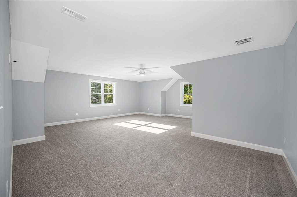 17 Norris Road Tyngsborough, MA 01879 - Photo 16 of 42 an empty room with windows and mirror