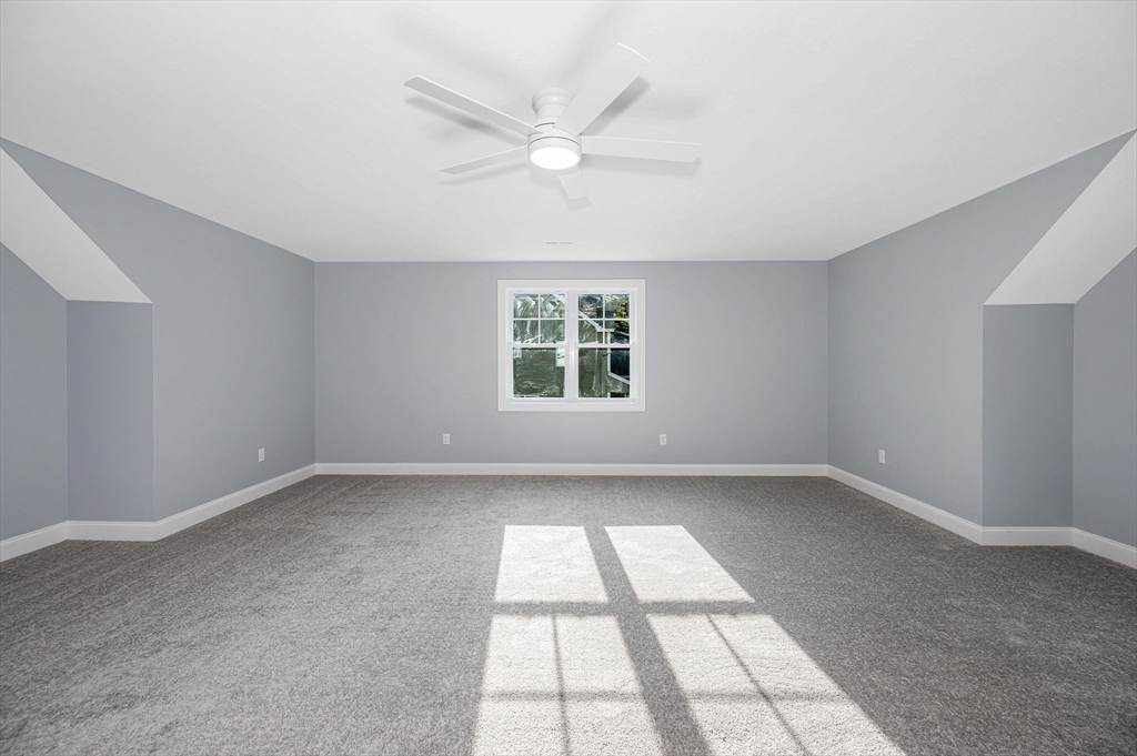 17 Norris Road Tyngsborough, MA 01879 - Photo 17 of 42 wooden floor in an empty room with a window