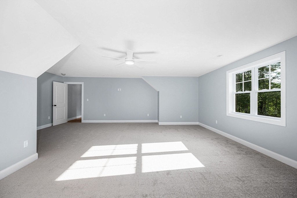 17 Norris Road Tyngsborough, MA 01879 - Photo 19 of 42 an empty room with a empty space and windows