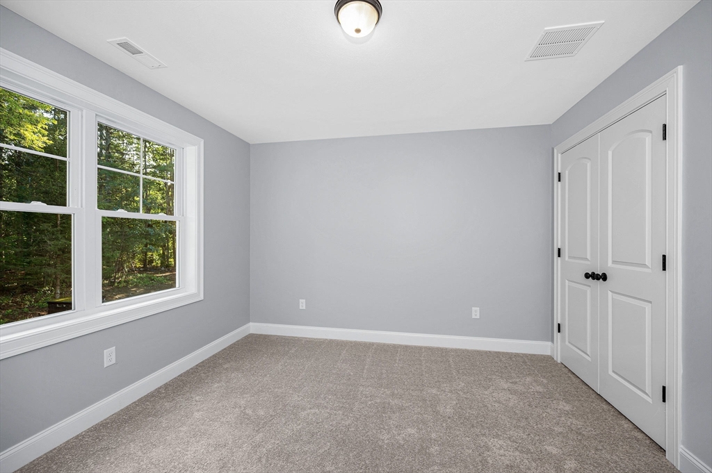 17 Norris Road Tyngsborough, MA 01879 - Photo 21 of 42 a view of an empty room with a window