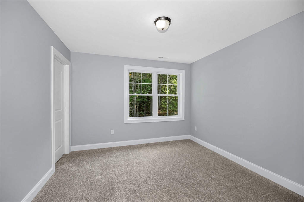 17 Norris Road Tyngsborough, MA 01879 - Photo 24 of 42 an empty room with a window