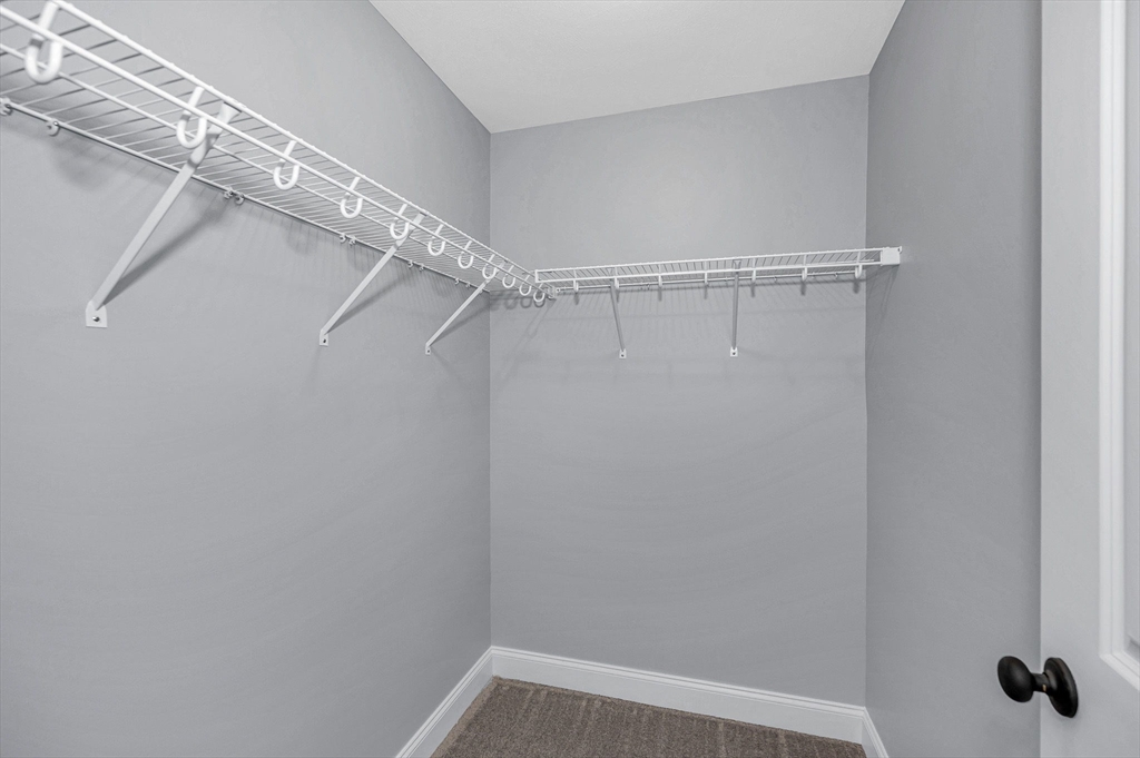 17 Norris Road Tyngsborough, MA 01879 - Photo 26 of 42 a view of a room with racks on the wall