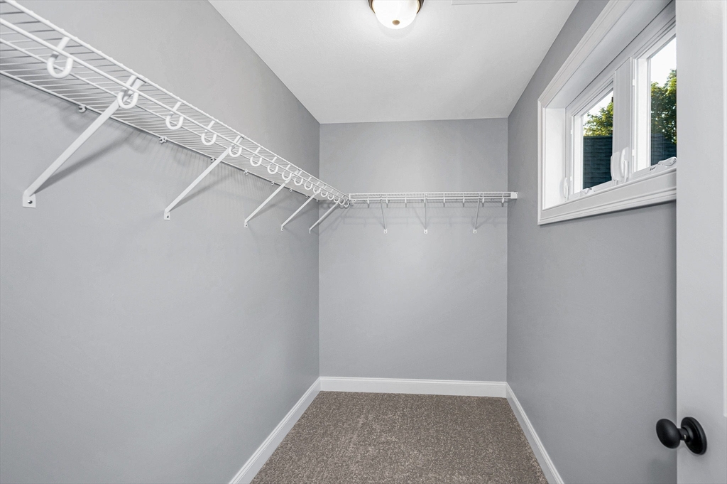 17 Norris Road Tyngsborough, MA 01879 - Photo 31 of 42 a view of a room with racks on the wall