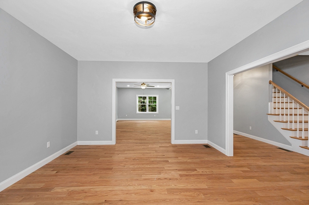 17 Norris Road Tyngsborough, MA 01879 - Photo 4 of 42 an empty room with window and wooden floor