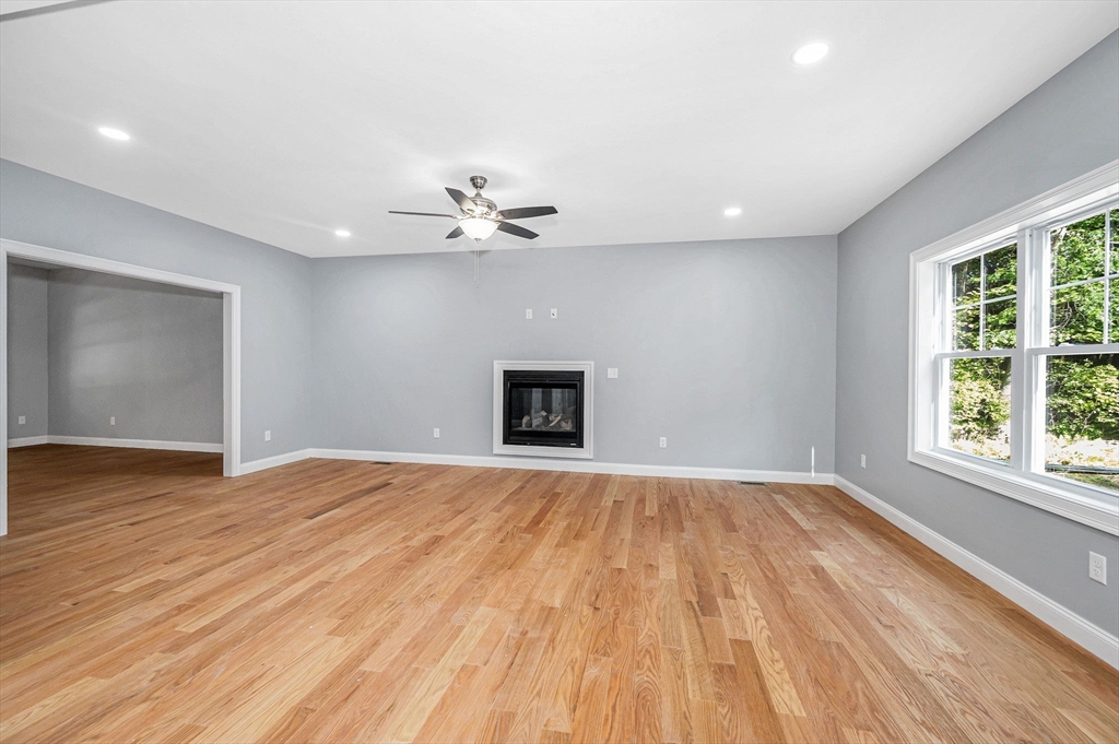 17 Norris Road Tyngsborough, MA 01879 - Photo 7 of 42 a view of an empty room with wooden floor and a window