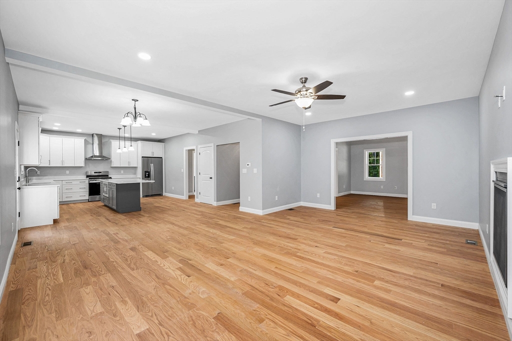 17 Norris Road Tyngsborough, MA 01879 - Photo 8 of 42 a view of an empty room with kitchen and window