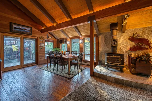 a living room with furniture and a floor to ceiling window