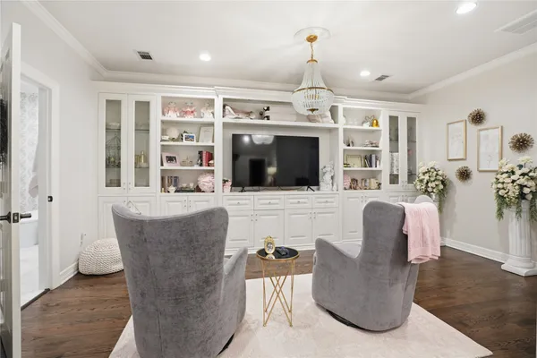 a living room with furniture and a rug