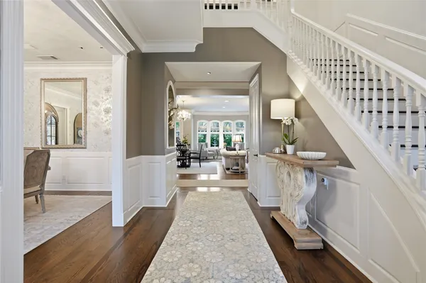 a view of entryway and hall with wooden floor