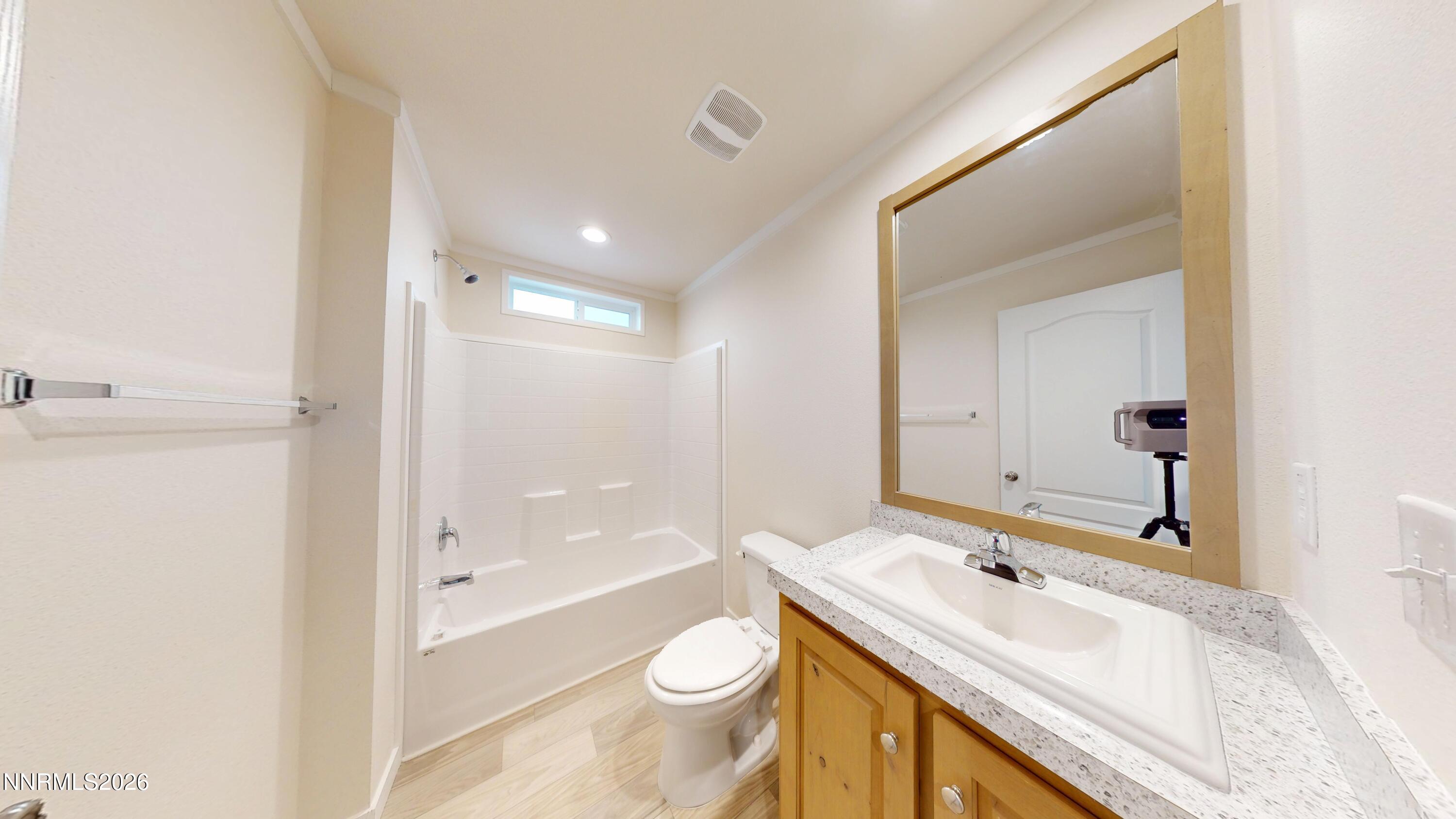 4890 Brayton Road Winnemucca, NV 89445 - Photo 18 of 20 a bathroom with a sink a toilet and shower