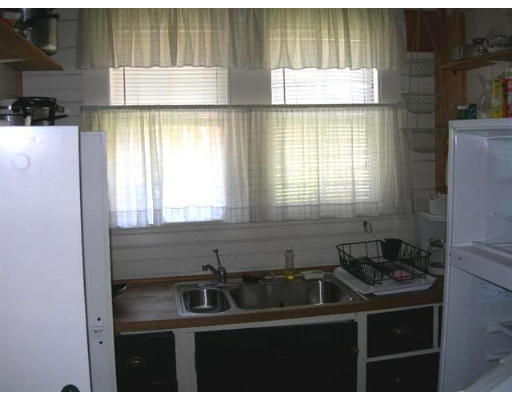 7 N Road Rockport, MA 01966 - Photo 2 of 7 a kitchen that has a sink and a window