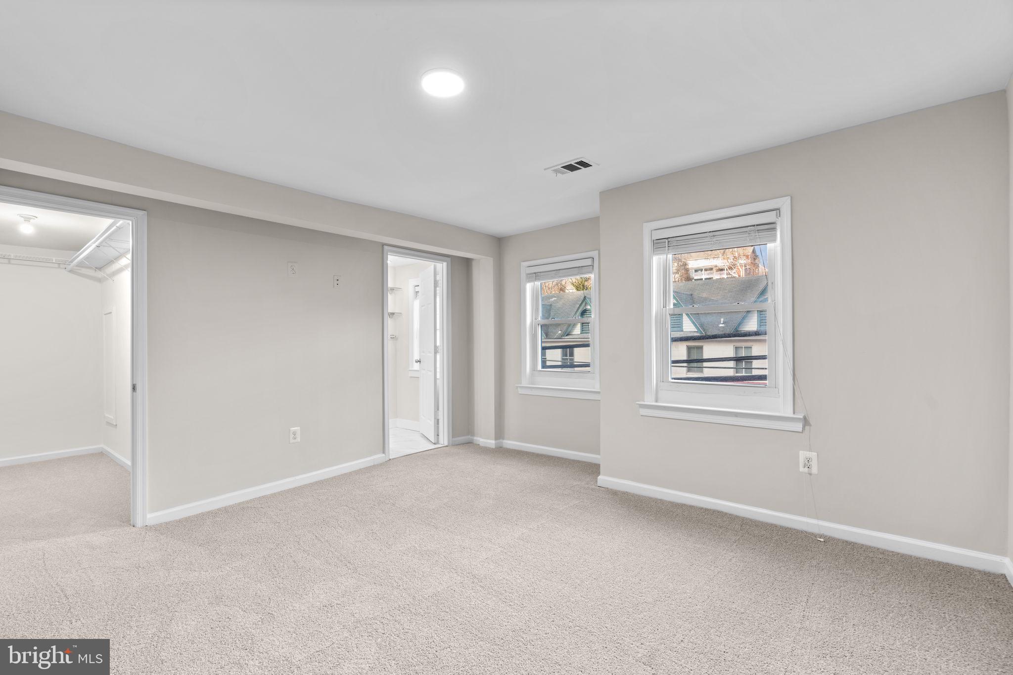 8483 Frederick Road Ellicott City, MD 21043 - Photo 18 of 44 a view of an empty room with a window