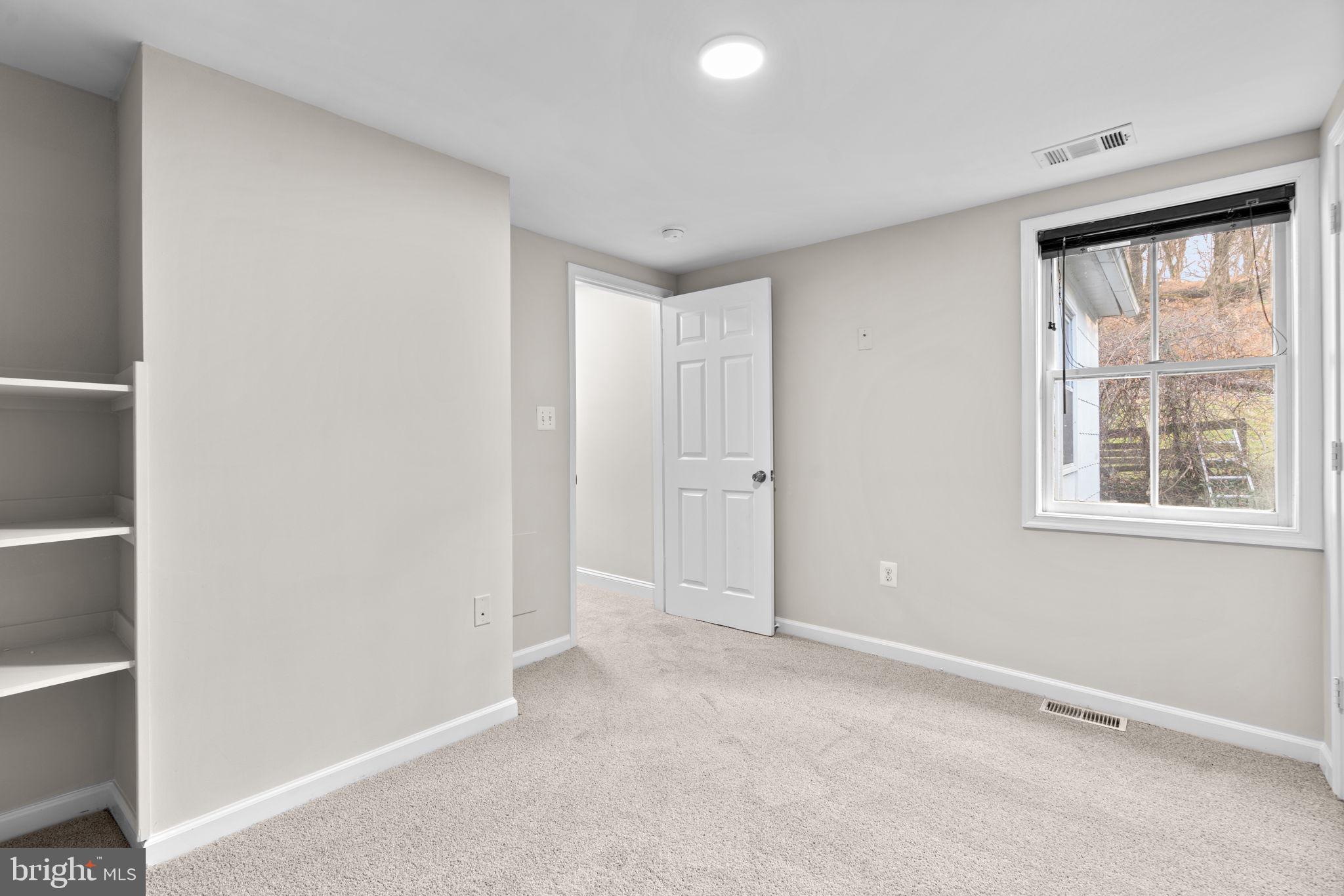 8483 Frederick Road Ellicott City, MD 21043 - Photo 28 of 44 a view of an empty room with a window